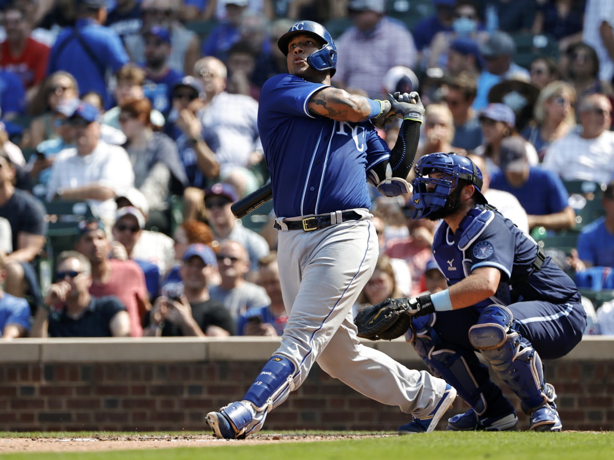 Aug 20, 2021; Chicago, Illinois, USA; Kansas City Royals catcher Salvador Perez (13) hits a solo home run against the Chicago Cubs during the sixth inning at Wrigley Field.